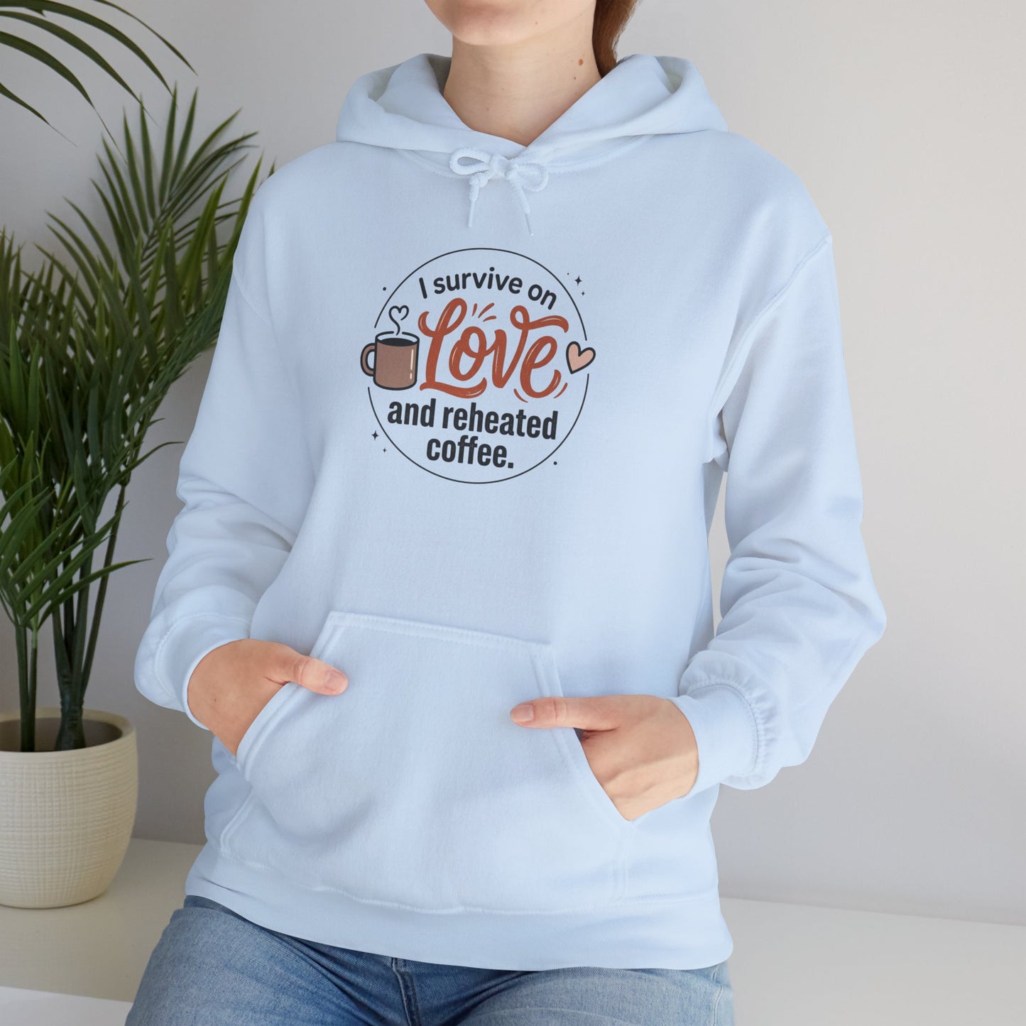 I Survive on Love and Reheated Coffee Hoodie